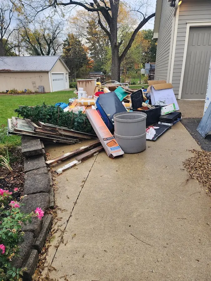 Dumpster being loaded with debris for Commercial Dumpster Rental in Bloomingdale
